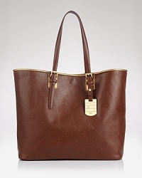 Designed with a timeless shape and sleek hardware, Longchamp's luxurious tote defines effortless day-right style. Designed with a timeless shape and sleek hardware, Longchamp's luxurious tote defines effortless day-right style.