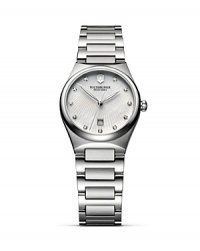 A poised timepiece from Victorinox Swiss Army features a luminous wristband and geometric-inspired diamond markers. A poised timepiece from Victorinox Swiss Army features a luminous wristband and geometric-inspired diamond markers.