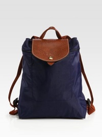Sporty and timeless, this backpack version of the signature pliage design has adjustable straps and iconic leather trim. Adjustable backpack straps, 13-36½ drop Top zipper and snap flap closures Inside open pocket Fully lined Polyamide canvas/leather trim 12½W X 11H X 4D Imported Sporty and timeless, this backpack version of the signature pliage design has adjustable straps and iconic leather trim. Adjustable backpack straps, 13-36½ drop Top zipper and snap flap closures Inside open pocket Fully lined Polyamide canvas/leather trim 12½W X 11H X 4D Imported