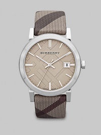 A true signature design with a check etched dial and a check strap. Quartz movementWater resistant to 5 ATMRound stainless steel case, 38mm (1.5) Smooth bezelTrench check stamped dialBar hour markersDate display at 3 o'clockSecond hand Trench smoke check strapMade in Switzerland A true signature design with a check etched dial and a check strap. Quartz movementWater resistant to 5 ATMRound stainless steel case, 38mm (1.5) Smooth bezelTrench check stamped dialBar hour markersDate display at 3 o'clockSecond hand Trench smoke check strapMade in Switzerland