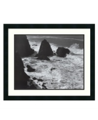 You can almost hear the sound of the waves crashing against the rocks in this timeless print from renowned photographer Ansel Adams. In elegant black and white with a matte black frame, the striking image evokes a sense of beauty and eternity in any space. You can almost hear the sound of the waves crashing against the rocks in this timeless print from renowned photographer Ansel Adams. In elegant black and white with a matte black frame, the striking image evokes a sense of beauty and eternity in any space.