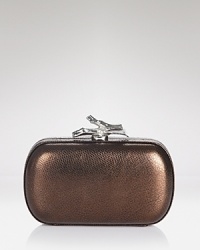 A shining example of evening style. This boxy, DIANE von FURSTENBERG clutch strikes it rich in metallic leather with a palm-perfect shape. A shining example of evening style. This boxy, DIANE von FURSTENBERG clutch strikes it rich in metallic leather with a palm-perfect shape.