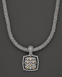 From the Naga collection, a gold and silver woven chain necklace with square Naga pendant, designed by John Hardy. From the Naga collection, a gold and silver woven chain necklace with square Naga pendant, designed by John Hardy.