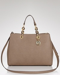Practical and undeniable luxurious, this satchel from MICHAEL Michael Kors is the ultimate daytime bag. Crafted from leather with a versatile shoulder strap, it's ideal for work or for weekends. Practical and undeniable luxurious, this satchel from MICHAEL Michael Kors is the ultimate daytime bag. Crafted from leather with a versatile shoulder strap, it's ideal for work or for weekends.