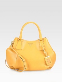 A roomy carryall in pebbled leather with a detachable strap.Double top handles, 5½ dropDetachable adjustable shoulder strap, 17¼-19 dropMagnetic snap closureMagnetic snap gussetsProtective metal feetOne inside zip pocketOne inside open pocketSignature jacquard lining12¼W X 10¾H X 5DMade in Italy A roomy carryall in pebbled leather with a detachable strap.Double top handles, 5½ dropDetachable adjustable shoulder strap, 17¼-19 dropMagnetic snap closureMagnetic snap gussetsProtective metal feetOne inside zip pocketOne inside open pocketSignature jacquard lining12¼W X 10¾H X 5DMade in Italy
