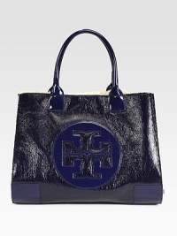 Textured patent leather in contrasting tones forms this roomy carryall, with a signature front emblem and plush wool lining. Double top handles, 7½ dropOpen topWool lining17W X 14H X 5½DImported Textured patent leather in contrasting tones forms this roomy carryall, with a signature front emblem and plush wool lining. Double top handles, 7½ dropOpen topWool lining17W X 14H X 5½DImported