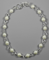 Pleasing glass pearls look positively pretty on this AK Anne Klein necklace complete with silvertone mixed metal. Approximate length: 17 inches. Pleasing glass pearls look positively pretty on this AK Anne Klein necklace complete with silvertone mixed metal. Approximate length: 17 inches.