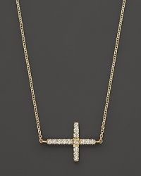 An elegant 14K. yellow gold cross, set with diamonds, on a slender chain. By Meira T. An elegant 14K. yellow gold cross, set with diamonds, on a slender chain. By Meira T.