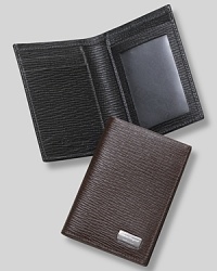 Salvatore Ferragamo Revival credit card holder with ID window. Textured leather credit card holder with two card pockets on right and clear pocket on left for ID. Features Ferragamo engraved on front plate. Salvatore Ferragamo Revival credit card holder with ID window. Textured leather credit card holder with two card pockets on right and clear pocket on left for ID. Features Ferragamo engraved on front plate.
