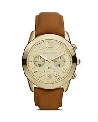 Borrow from the boys with this handsome gold plated watch from Michael Kors. It's bold dial, oversized face and rugged strap are the perfect foil for feminine looks. Borrow from the boys with this handsome gold plated watch from Michael Kors. It's bold dial, oversized face and rugged strap are the perfect foil for feminine looks.