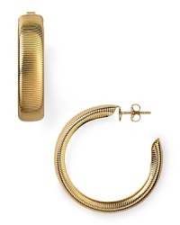 R.J. Graziano puts a textured spin on the classic hoop earrings. Wear this gold-plated pair to add understated shine to every look. R.J. Graziano puts a textured spin on the classic hoop earrings. Wear this gold-plated pair to add understated shine to every look.