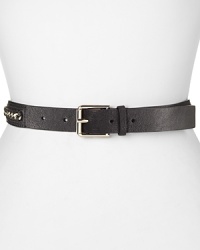 A bold all-around chain details this Cole Haan leather belt, styled to add a biker chic edge to a standard jeans and tee combination. A bold all-around chain details this Cole Haan leather belt, styled to add a biker chic edge to a standard jeans and tee combination.