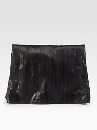 Sumptuously smooth leather finished with vertical stitching in a sleek foldover bag.Magnetic flap closureOne inside zip pocketCotton lining13¼W X 10H X 1¼DMade in Italy Sumptuously smooth leather finished with vertical stitching in a sleek foldover bag.Magnetic flap closureOne inside zip pocketCotton lining13¼W X 10H X 1¼DMade in Italy