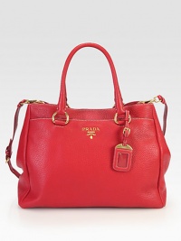 Pebbled leather with goldtone hardware.Double top handles, 6 dropDetachable adjustable shoulder strap, 17¼-19½ dropSnap button closureProtective metal feetTwo outside snap button pocketsSnap button gussetsOne inside zip pocketOne inside open pocketFully lined14½W X 10H X 7DMade in Italy Pebbled leather with goldtone hardware.Double top handles, 6 dropDetachable adjustable shoulder strap, 17¼-19½ dropSnap button closureProtective metal feetTwo outside snap button pocketsSnap button gussetsOne inside zip pocketOne inside open pocketFully lined14½W X 10H X 7DMade in Italy