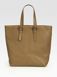 Signature Intrecciato weave of ultra supple nappa lambskin, crafted in an incredibly roomy silhouette.Double top handles, 7½ dropOne inside zip pocketOne cell phone pocketSuede lining12¼W X 14¼H X 5DMade in Italy Signature Intrecciato weave of ultra supple nappa lambskin, crafted in an incredibly roomy silhouette.Double top handles, 7½ dropOne inside zip pocketOne cell phone pocketSuede lining12¼W X 14¼H X 5DMade in Italy