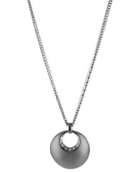 A circular notion. This necklace from Kenneth Cole New York is crafted from silver- and hematite-tone mixed metal with a sculptural circle pendant adorned by glass pave crystal accents shining through. Approximate length: 18 inches + 3-inch extender. Approximate drop: 1-3/4 inches. A circular notion. This necklace from Kenneth Cole New York is crafted from silver- and hematite-tone mixed metal with a sculptural circle pendant adorned by glass pave crystal accents shining through. Approximate length: 18 inches + 3-inch extender. Approximate drop: 1-3/4 inches.