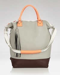 Join the color block bag party with this oversized leather tote from DIANE von FURSTENBERG. Designed to meet daytime demands, it's a bright alternative to a staid solid. Join the color block bag party with this oversized leather tote from DIANE von FURSTENBERG. Designed to meet daytime demands, it's a bright alternative to a staid solid.