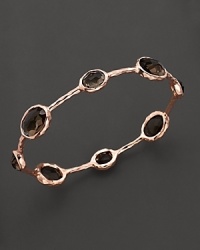 From the Rosé collection, eight smoky quartz stations on a hammered bangle. Designed by Ippolita. From the Rosé collection, eight smoky quartz stations on a hammered bangle. Designed by Ippolita.