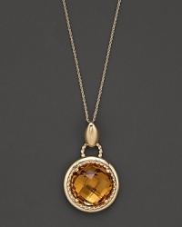 An expertly-rendered, faceted round citrine pendant set in 16 Kt. gold, with fine link chain. An expertly-rendered, faceted round citrine pendant set in 16 Kt. gold, with fine link chain.