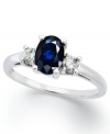 A subtle touch of blue. This vibrant 14k white gold ring features an oval-cut sapphire (1-1/8 ct. t.w.) and round-cut diamond side stones (1/5 ct. t.w.).