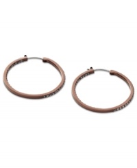 A delicious hoop design from Fossil. These earrings feature added glitz with hematite tone pave crystal accents. Crafted in brown tone mixed metal. Approximate diameter: 1-3/8 inches. A delicious hoop design from Fossil. These earrings feature added glitz with hematite tone pave crystal accents. Crafted in brown tone mixed metal. Approximate diameter: 1-3/8 inches.