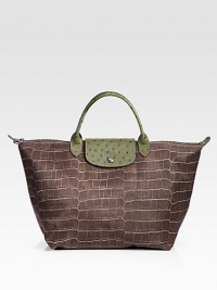 An updated design in an exotic-inspired print on nylon with ostrich-embossed leather trim.Double leather handles, 4½ dropTop zip and snap flap closureOne inside open pocketPVC backing11¾W X 11H X 8DImported An updated design in an exotic-inspired print on nylon with ostrich-embossed leather trim.Double leather handles, 4½ dropTop zip and snap flap closureOne inside open pocketPVC backing11¾W X 11H X 8DImported