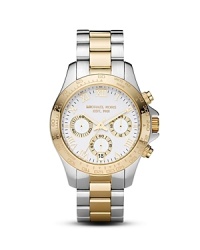 This classic two-tone watch from MICHAEL Michael Kors boasts a three-eye dial and quartz movement. This classic two-tone watch from MICHAEL Michael Kors boasts a three-eye dial and quartz movement.