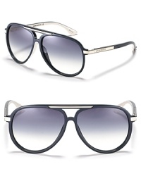 Retro-inspired aviator sunglasses with metal trim along bridge and temples. Retro-inspired aviator sunglasses with metal trim along bridge and temples.