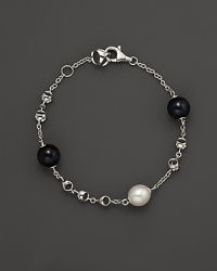 A bold sterling silver chain bracelet, gleaming with blue tigers eye and freshwater pearl. By Di MODOLO. A bold sterling silver chain bracelet, gleaming with blue tigers eye and freshwater pearl. By Di MODOLO.