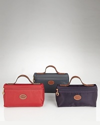 A sleek and stylish nylon cosmetic pouch from Longchamp. A sleek and stylish nylon cosmetic pouch from Longchamp.