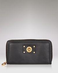 Part of the Totally Turnlock collection from MARC BY MARC JACOBS. A single turnlock lends luxe appeal to this zip-around leather wallet. Part of the Totally Turnlock collection from MARC BY MARC JACOBS. A single turnlock lends luxe appeal to this zip-around leather wallet.