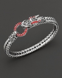 Eastern elements inform John Hardy's dragon head bracelet, featuring a polished silver link band and dragon head clasp with red sapphire. Eastern elements inform John Hardy's dragon head bracelet, featuring a polished silver link band and dragon head clasp with red sapphire.