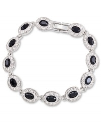 Black is back and extra glam with the Carolee flex bracelet. Crafted from silver-tone mixed metal, the bracelet features black glass stones adorned in sparkling accents. Approximate length: 7 inches. Black is back and extra glam with the Carolee flex bracelet. Crafted from silver-tone mixed metal, the bracelet features black glass stones adorned in sparkling accents. Approximate length: 7 inches.