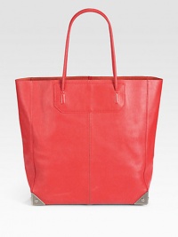 A classic leather tote in a chic look-at-me hue.Double top handles, 7¾ dropProtective metal feetTwo open inner compartmentsOne inner zip pouch12W X 13¼H X 4¼DImported A classic leather tote in a chic look-at-me hue.Double top handles, 7¾ dropProtective metal feetTwo open inner compartmentsOne inner zip pouch12W X 13¼H X 4¼DImported
