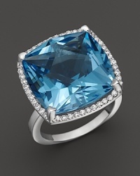 A cushion cut blue topaz is framed by diamonds in this sparkling 18K white gold ring from Lisa Nik's Rocks Collection. A cushion cut blue topaz is framed by diamonds in this sparkling 18K white gold ring from Lisa Nik's Rocks Collection.