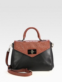 For a textured look, this soft leather two-tone silhouette has luxe ostrich-embossed details. Adjustable detachable ostrich-embossed leather shoulder strap, 20-22 dropOstrich-embossed top handle, 4½ dropTurn-lock closure on front flapProtective metal feetOne inside zip pocketTwo inside open pocketsCotton lining10¾W X 9H X 4½DImported For a textured look, this soft leather two-tone silhouette has luxe ostrich-embossed details. Adjustable detachable ostrich-embossed leather shoulder strap, 20-22 dropOstrich-embossed top handle, 4½ dropTurn-lock closure on front flapProtective metal feetOne inside zip pocketTwo inside open pocketsCotton lining10¾W X 9H X 4½DImported