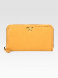 This pebbled leather classic with an exposed metallic zipper closure is a luxurious addition to last for seasons. Zip around closure Two bill slots Eight credit card slots Center zip compartment Calfskin lining 7W X 4H X 1D Made in Italy This pebbled leather classic with an exposed metallic zipper closure is a luxurious addition to last for seasons. Zip around closure Two bill slots Eight credit card slots Center zip compartment Calfskin lining 7W X 4H X 1D Made in Italy