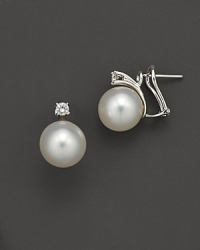South Sea pearls with a gold and diamond loop. Omega back and post for pierced ears. South Sea pearls with a gold and diamond loop. Omega back and post for pierced ears.