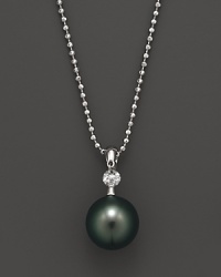 A timeless classic, this Tara Pearls necklace combines 18K white gold with a black Tahitian pearl, detailed with a sparkling diamond accent. A timeless classic, this Tara Pearls necklace combines 18K white gold with a black Tahitian pearl, detailed with a sparkling diamond accent.