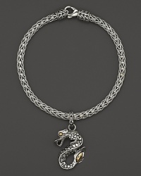 18K yellow gold accents this hand-crafted sterling silver dragon charm bracelet from John Hardy's Naga collection. 18K yellow gold accents this hand-crafted sterling silver dragon charm bracelet from John Hardy's Naga collection.