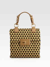 Nylon jacquard flap bag with gusset.Saffiano leather top handle, 5½ dropClock lock closureThree inner compartmentsOne inside zip pocketThree inside open pocketsSignature jacquard lining10¼W X 9½H X 4DMade in Italy Nylon jacquard flap bag with gusset.Saffiano leather top handle, 5½ dropClock lock closureThree inner compartmentsOne inside zip pocketThree inside open pocketsSignature jacquard lining10¼W X 9½H X 4DMade in Italy