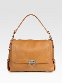 A flap-top slouchy carryall of ultra-luxe pebbled leather, topped off with polished hardware. Top handle, 7½ dropFlap-lock closureProtective metal feetOne inside zip pocketTwo inside open pocketsFully lined15W X 10H X 5DMade in Italy A flap-top slouchy carryall of ultra-luxe pebbled leather, topped off with polished hardware. Top handle, 7½ dropFlap-lock closureProtective metal feetOne inside zip pocketTwo inside open pocketsFully lined15W X 10H X 5DMade in Italy