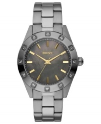 A striking watch design by DKNY that breaks free from feminine details. A striking watch design by DKNY that breaks free from feminine details.