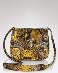 Serpentine style plays muse to this exotically-embossed leather crossbody from Rebecca Minkoff. Snake, rattle, and roll, this piece is ready to slither from desk-to-dinner with audacious ease. Serpentine style plays muse to this exotically-embossed leather crossbody from Rebecca Minkoff. Snake, rattle, and roll, this piece is ready to slither from desk-to-dinner with audacious ease.