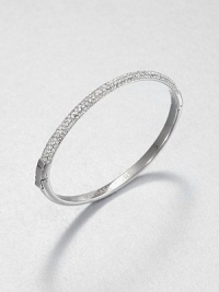 From the Brilliance Collection. Half of this graceful bangle is paved with sparkling rhinestones, the other half has a smooth, polished finish, with a handy hinge in between.GlassSilvertoneDiameter, about 2.5Hinged with push-lock claspImported From the Brilliance Collection. Half of this graceful bangle is paved with sparkling rhinestones, the other half has a smooth, polished finish, with a handy hinge in between.GlassSilvertoneDiameter, about 2.5Hinged with push-lock claspImported