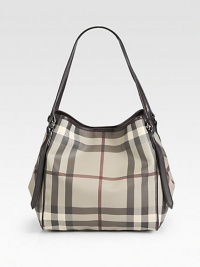 Rich leather trim lines this rounded carryall, featuring the signature Burberry smoked check on coated denim. Double leather shoulder straps, 8¼ dropMagnetic snap closureProtective metal feetOne inside zip pocketLinen lining10W X 10H X 3½DMade in Italy Rich leather trim lines this rounded carryall, featuring the signature Burberry smoked check on coated denim. Double leather shoulder straps, 8¼ dropMagnetic snap closureProtective metal feetOne inside zip pocketLinen lining10W X 10H X 3½DMade in Italy