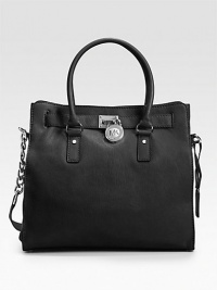 Beautifully tailored and versatile design of rich leather, finished with double top handles and a shoulder strap.Double top handles, 5 drop Chain and leather shoulder strap, 12 drop Magnetic snap closure Protective metal feet One inside zip pocket Four inside open pockets Fully lined 14W X 13H X 5½D Imported Beautifully tailored and versatile design of rich leather, finished with double top handles and a shoulder strap.Double top handles, 5 drop Chain and leather shoulder strap, 12 drop Magnetic snap closure Protective metal feet One inside zip pocket Four inside open pockets Fully lined 14W X 13H X 5½D Imported
