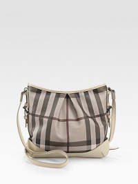 Chic Burberry check PVC, shaped by soft pleats in a slouchy carryall, finished with rich calfskin trim.Adjustable crossbody strap, 19-22½ dropTop zip closureOne inside zip pocketTwo inside open pocketsCotton lining12W X 10H X 1/2DImported Chic Burberry check PVC, shaped by soft pleats in a slouchy carryall, finished with rich calfskin trim.Adjustable crossbody strap, 19-22½ dropTop zip closureOne inside zip pocketTwo inside open pocketsCotton lining12W X 10H X 1/2DImported