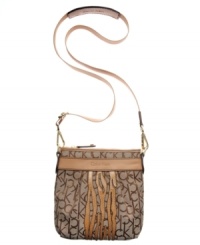 Soft leather trim and subtle zebra design add graphic contrast to the signature jacquard fabric of this go-anywhere Calvin Klein design. Pockets inside and out keep you well-organized, while the adjustable strap is easily removed to transform this crossbody into a clutch. Soft leather trim and subtle zebra design add graphic contrast to the signature jacquard fabric of this go-anywhere Calvin Klein design. Pockets inside and out keep you well-organized, while the adjustable strap is easily removed to transform this crossbody into a clutch.