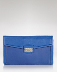 The effortless style of Cole Haan is ready for night, crafted of leather and designed with pockets to hold all of the desk-to-dinner essentials. The effortless style of Cole Haan is ready for night, crafted of leather and designed with pockets to hold all of the desk-to-dinner essentials.